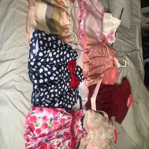 7 little girl dresses some worn once or twice and some with tags .